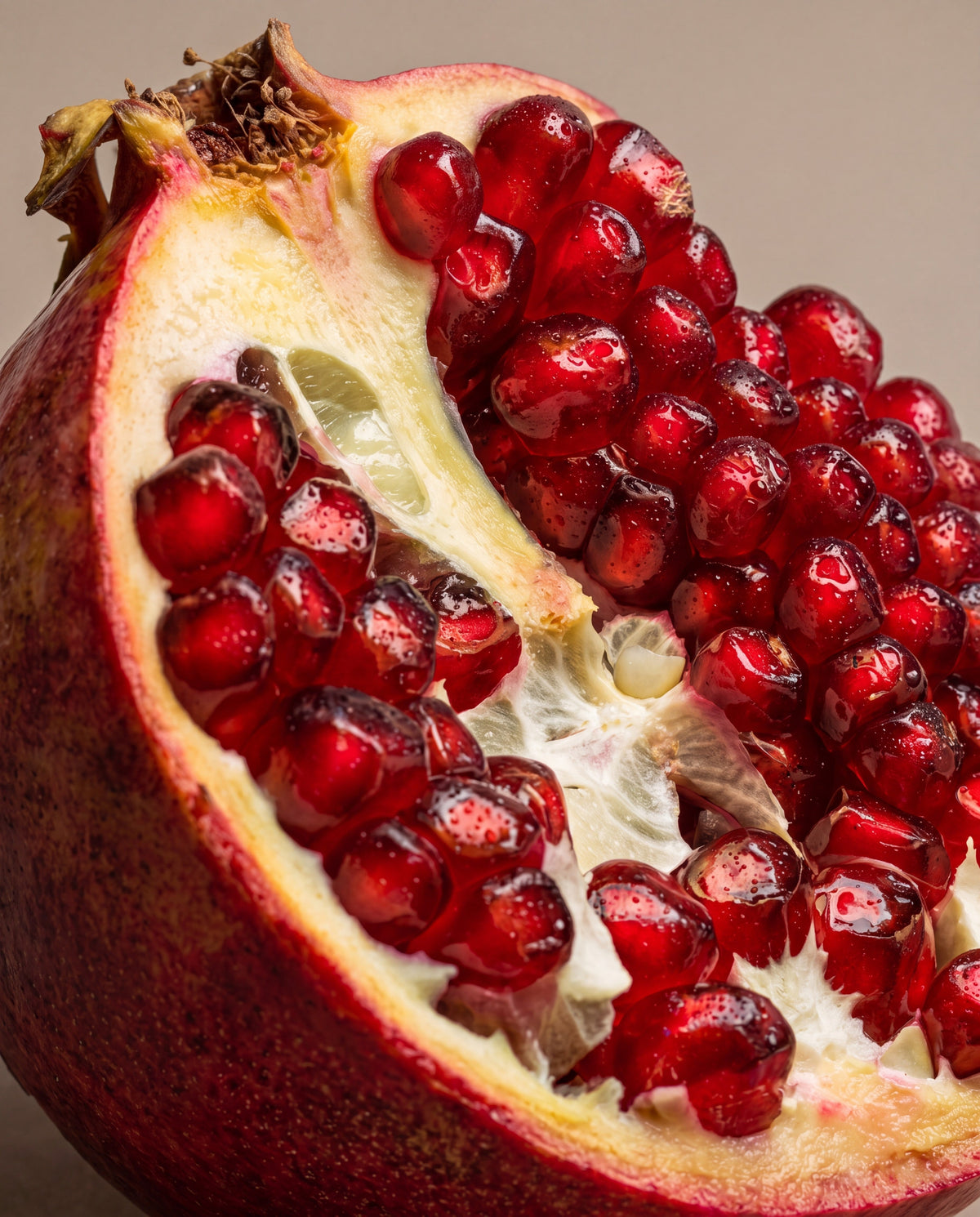 Dark Pomegranate scent notes: a pomegranate broken open with ruby seeds