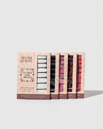Noir (Non-UV Nail Wraps): row of Delune Beauty UV-free nail wrap packs standing upright